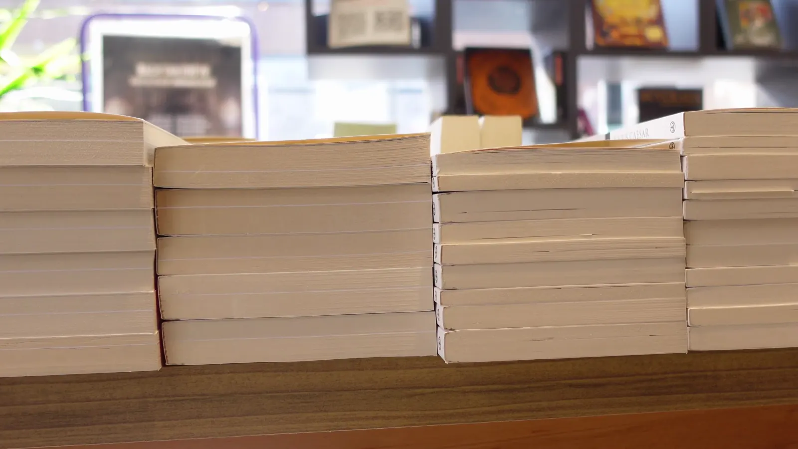 Books stacked on a shop table.